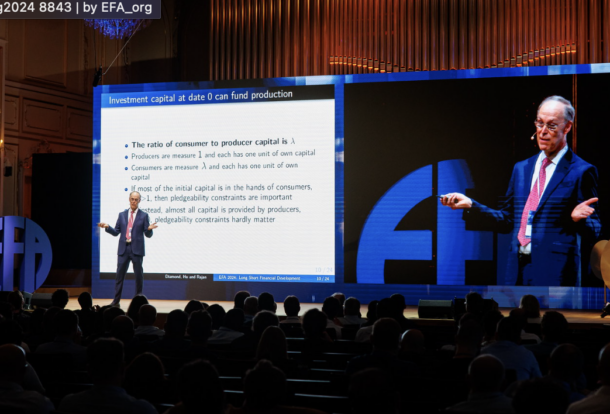 Doug Diamond delivering the keynote speech on stage